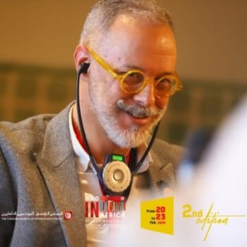 A Mediterranean delegate using interpretation headphones during the meeting.