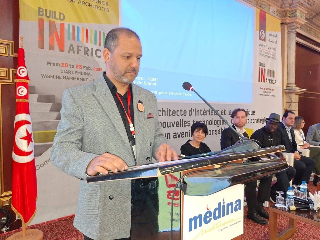 A MIA representative speaking at the Build in Africa lectern in Hammamet.