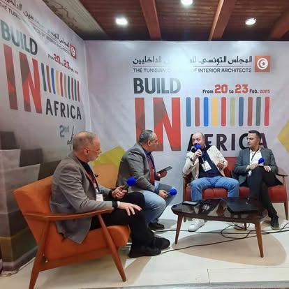 Four speakers in conversation during a Build in Africa panel in Hammamet.